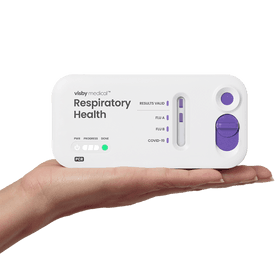 Visby Medical Respiratory Health Test in hand.